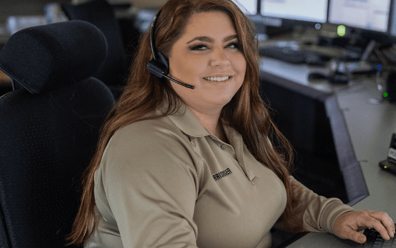 A Kern County Sheriff's Dispatcher seated at her console
